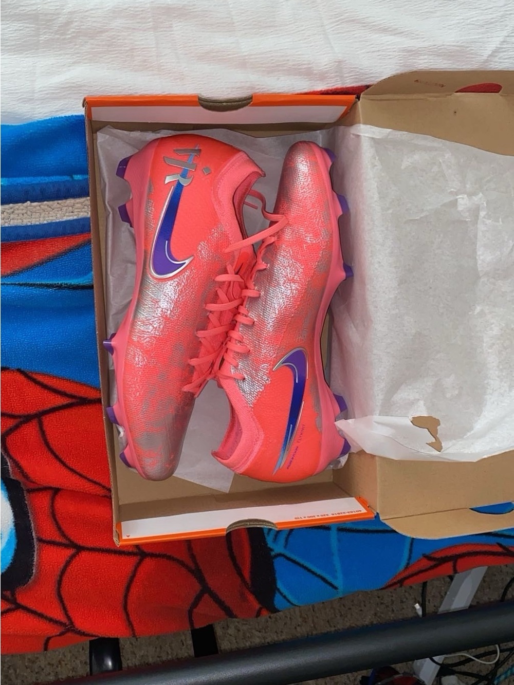 Nike Pink/Coral Soccer Cleats with Blue Swoosh